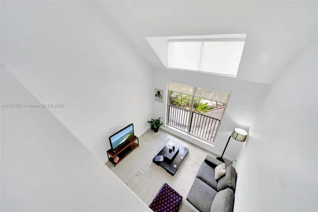view of living room with furniture and a window