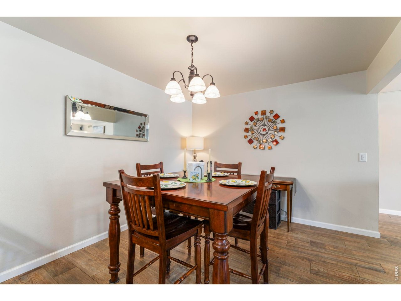 39 Ward Drive, Unit 104 Greeley, CO 80634 - Photo 12 of 31 a view of a dining room with furniture and wooden floor