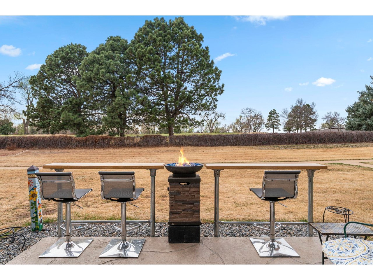 39 Ward Drive, Unit 104 Greeley, CO 80634 - Photo 27 of 31 a view of swimming pool with outdoor seating and yard in back