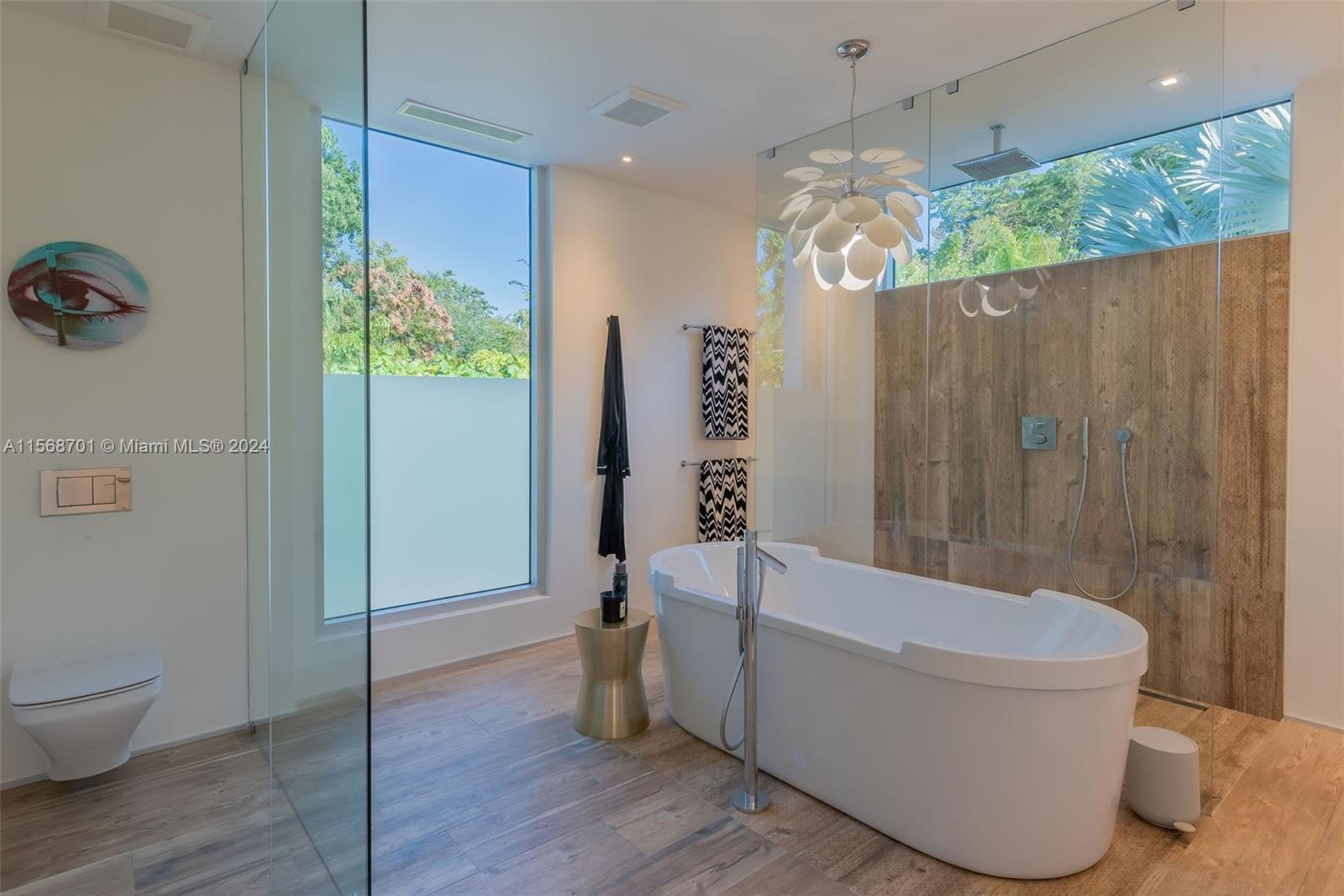 6795 Southwest 113th Street Pinecrest, FL 33156 - Photo 15 of 30 a bathroom with a sink a toilet and shower