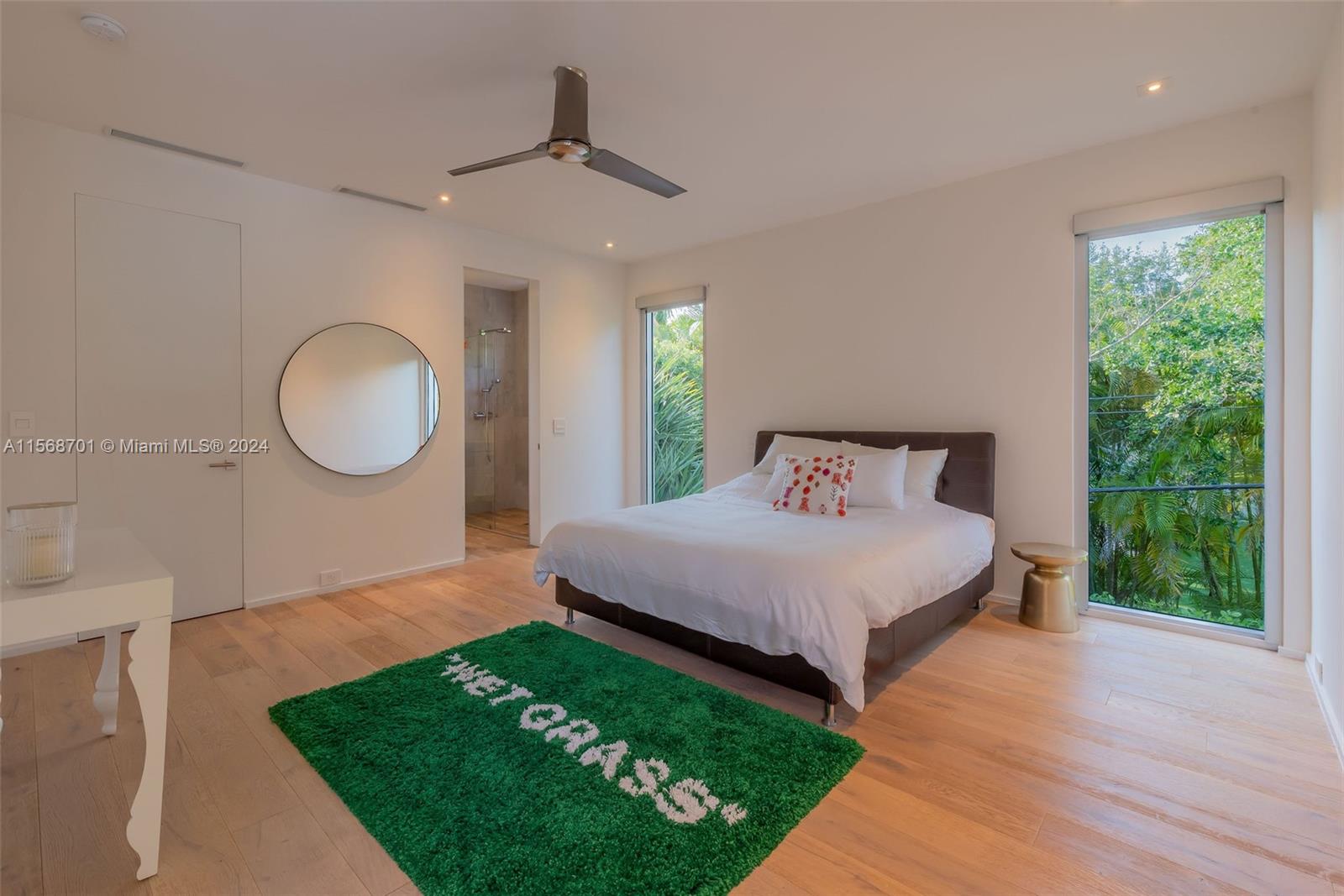 6795 Southwest 113th Street Pinecrest, FL 33156 - Photo 16 of 30 a bedroom with a bed and a window