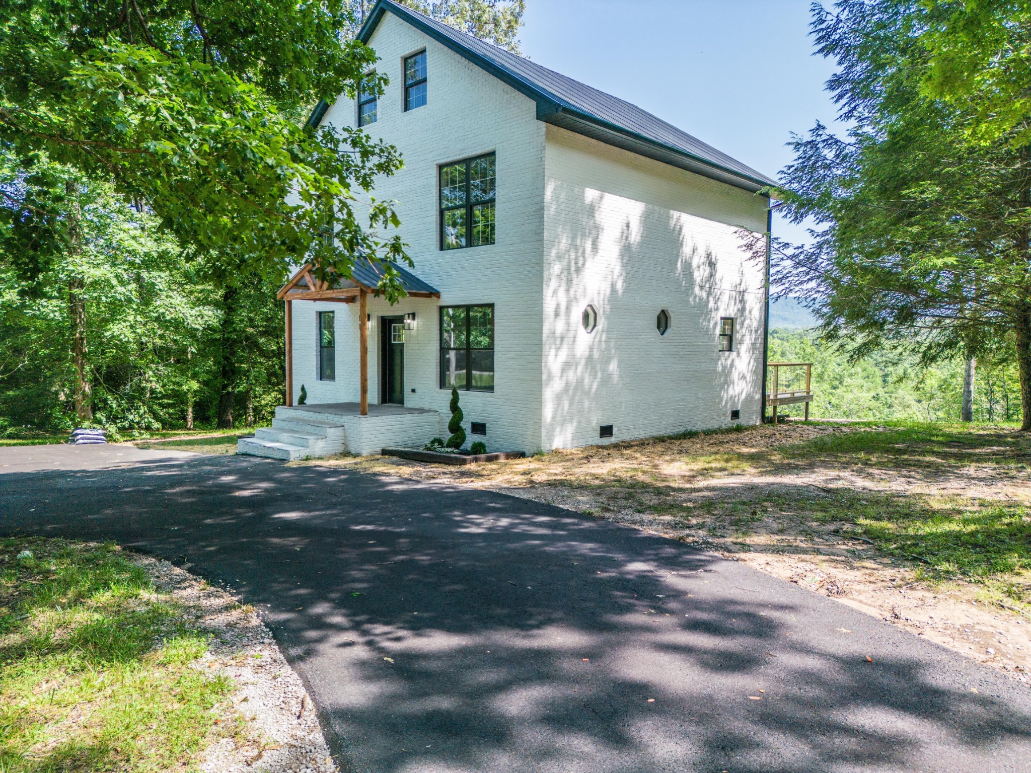 1668 Russell Ridge Road Crossville, TN 38555 - Photo 3 of 38 a view of a house with backyard and a tree
