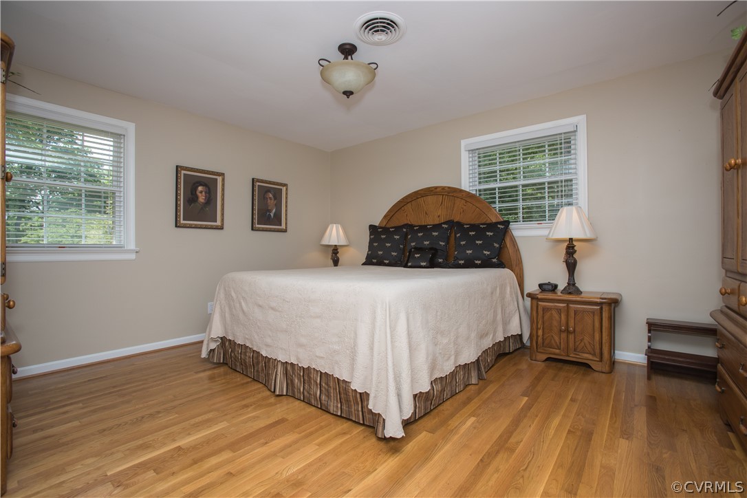 1620 Featherstone Drive Midlothian, VA 23113 - Photo 19 of 29 a bedroom with a bed and wooden floor