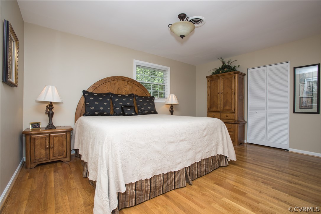 1620 Featherstone Drive Midlothian, VA 23113 - Photo 20 of 29 a bedroom with a bed and wooden floor