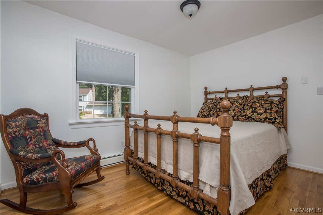 1620 Featherstone Drive Midlothian, VA 23113 - Photo 22 of 29 a bed sitting in a bedroom next to a window