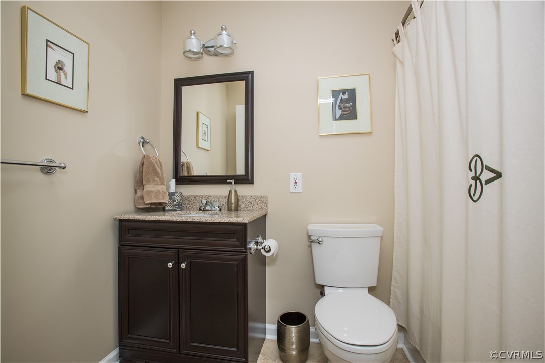 1620 Featherstone Drive Midlothian, VA 23113 - Photo 26 of 29 a bathroom with a toilet a sink and mirror