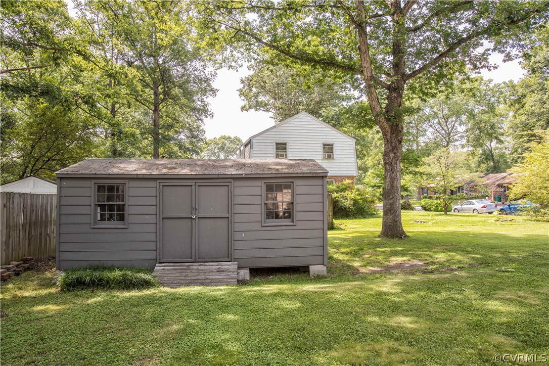 1620 Featherstone Drive Midlothian, VA 23113 - Photo 29 of 29 a view of a backyard with wooden fence and large trees