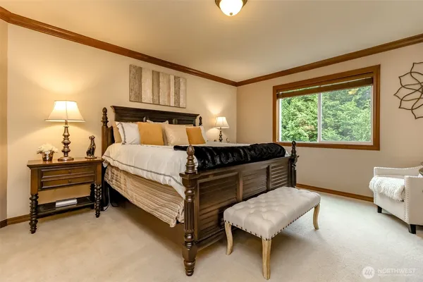 a bedroom with furniture and a window