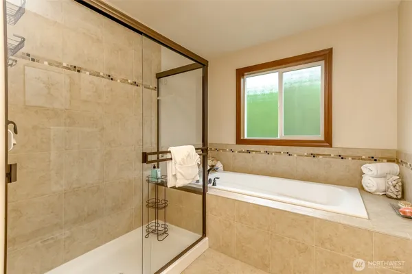 a bath tub sitting next to a window