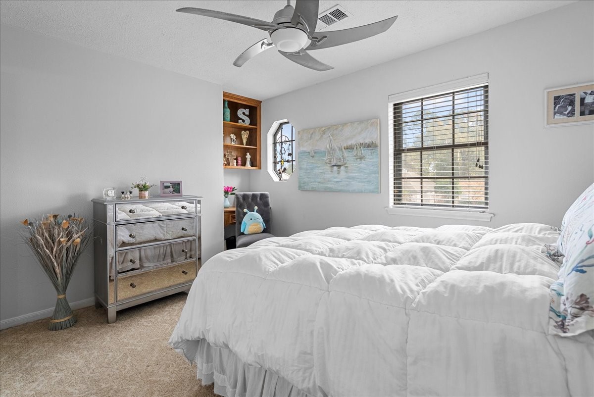 7111 Tonkawa Street Baytown, TX 77521 - Photo 16 of 23 a bedroom with a bed and a window