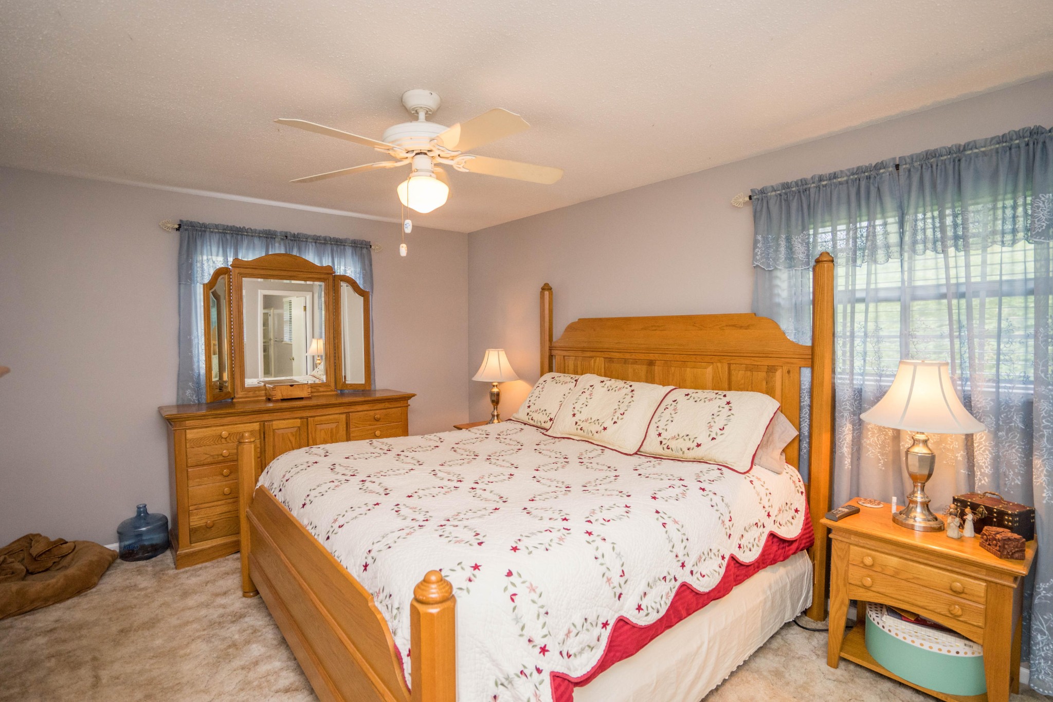 441 Orchard Knob Road Clinton, TN 37716 - Photo 13 of 33 a bedroom with a bed and wooden floor
