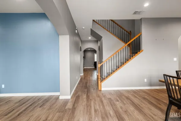 a view of a dining room with furniture and wooden floor