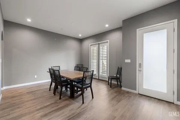 a view of a dining room with furniture and wooden floor