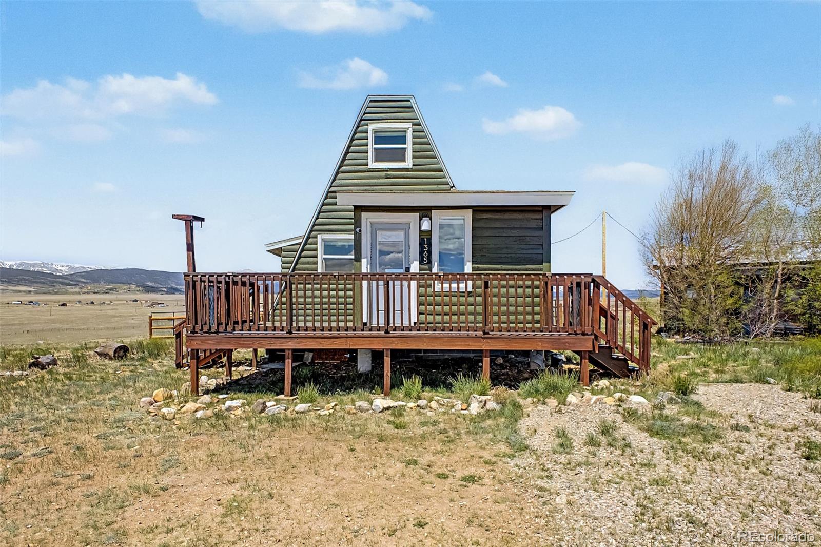 1365 Kokanee Road Fairplay, CO 80440 - Photo 1 of 45 a view of a house with a yard and furniture