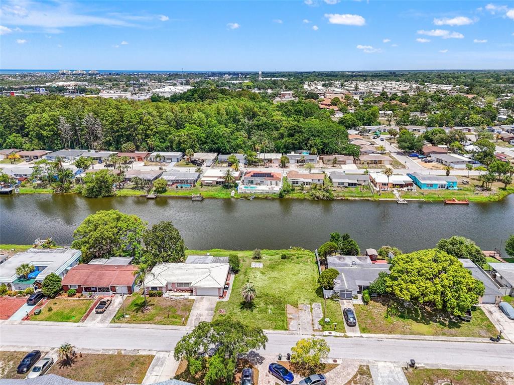 7211 Ashwood Drive Port Richey, FL 34668 - Photo 4 of 12 a view of a lake with outdoor space