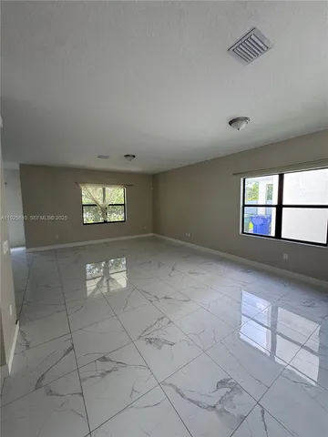 a view of a livingroom and window