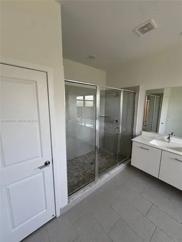 a bathroom with a tub and shower