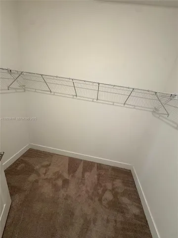 a bathroom with a tub a toilet and a bathtub