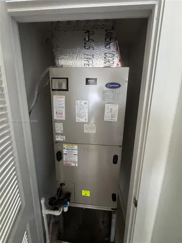 a utility room with a sink a vanity and mirror