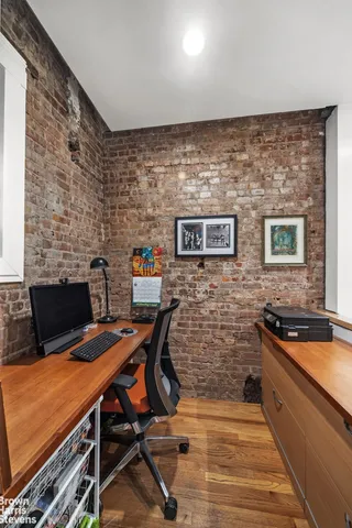 a view of a workspace with furniture