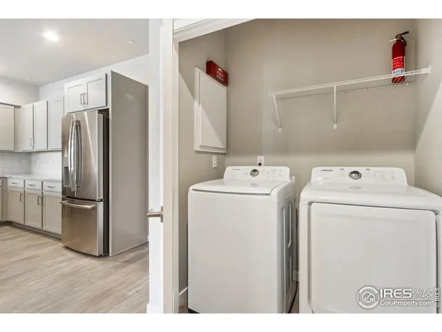 a utility room with closet dryer and washer