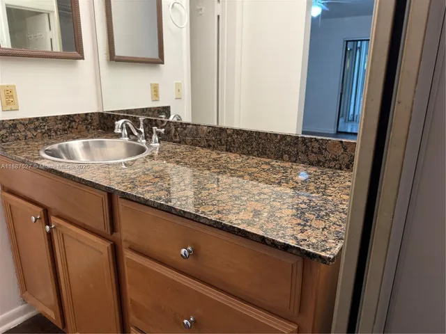 a close view of sink and mirror