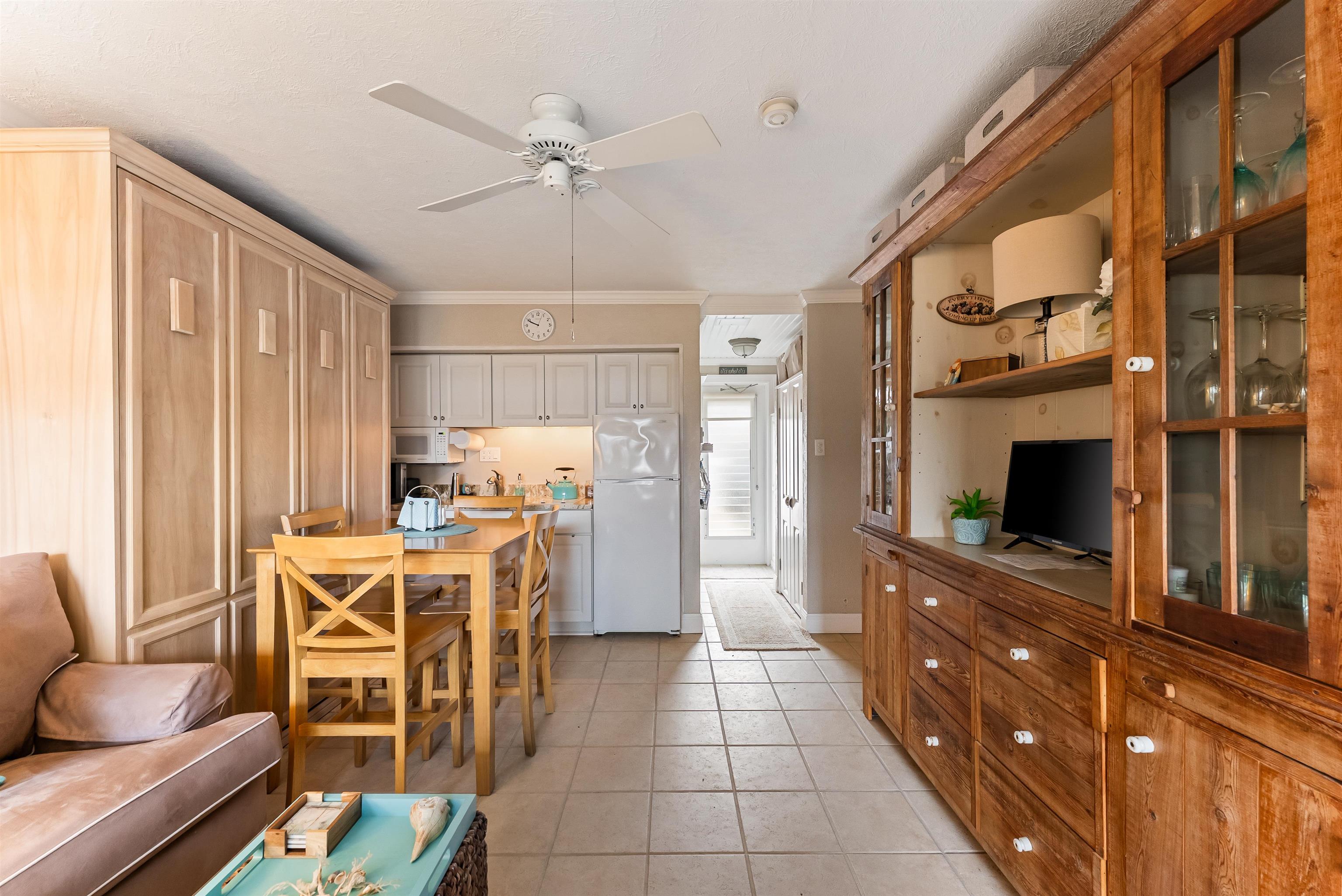 10120 3rd, Unit 4 Strathmere, NJ 08248 - Photo 7 of 14 a view of a dining room with furniture window and wooden floor