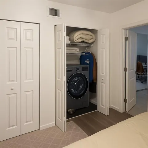 a view of a storage & utility room with washer and dryer