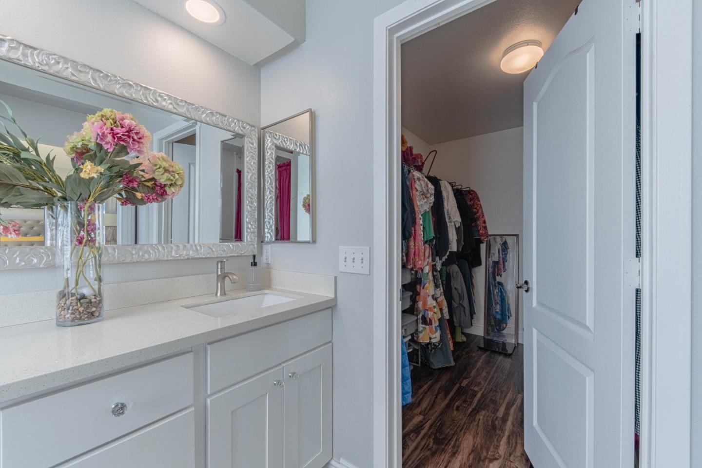 25215 Azalea Court Salinas, CA 93908 - Photo 34 of 48 a bathroom with a sink vanity and a mirror