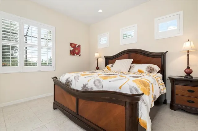 a bed sitting in a room next to a window