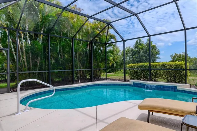 a view of a patio with a table chairs and a garden
