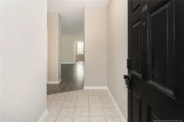 a view of a closet area with living room