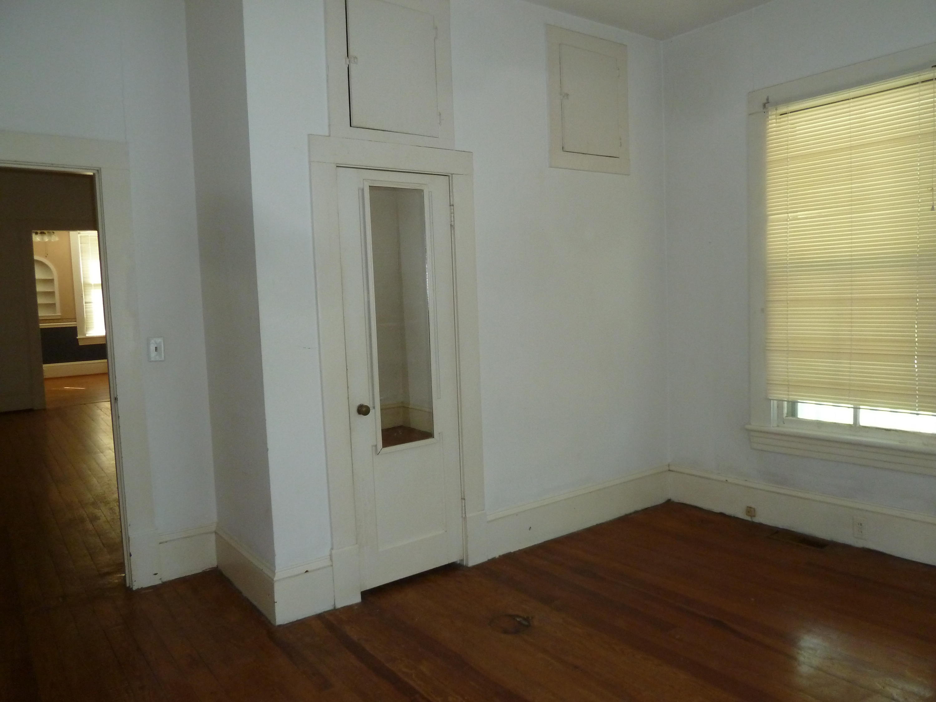 40 Spring Street Rocky Mount, VA 24151 - Photo 22 of 31 an empty room with wooden floor and windows