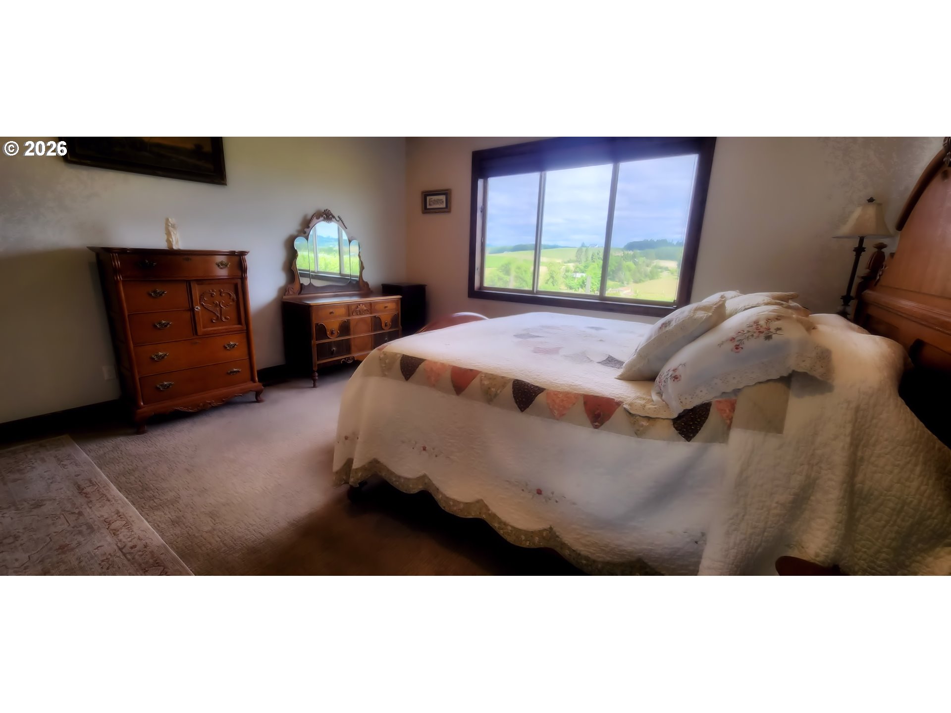 18700 Northwest Adcock Road Yamhill, OR 97148 - Photo 13 of 42 a bed room with a bed window and a table
