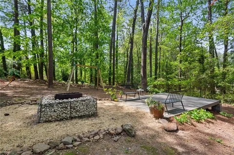 a view of backyard with a patio