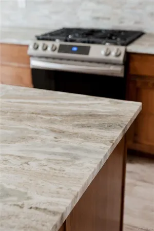 a kitchen with a sink a window and wooden floor