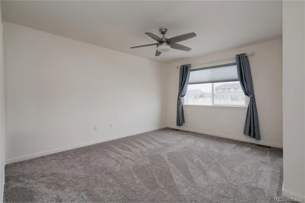 a view of an empty room and closet area