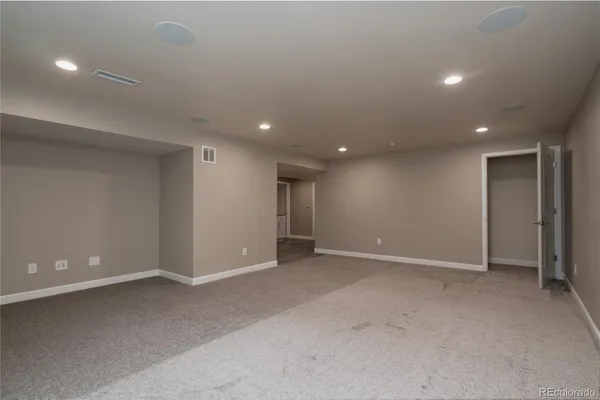 a view of a hallway to rooms