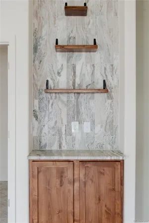 a view of a livingroom with furniture window and wooden floor