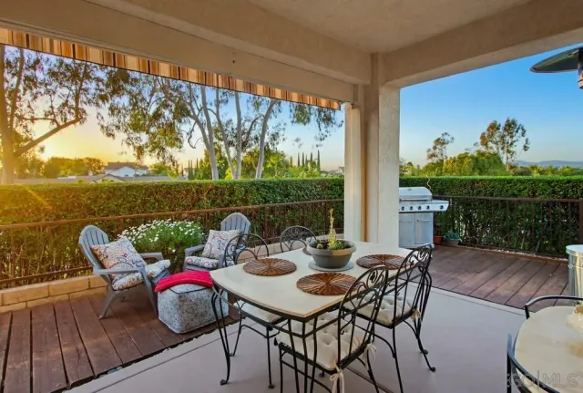 a outdoor view with a sitting space garden and furniture