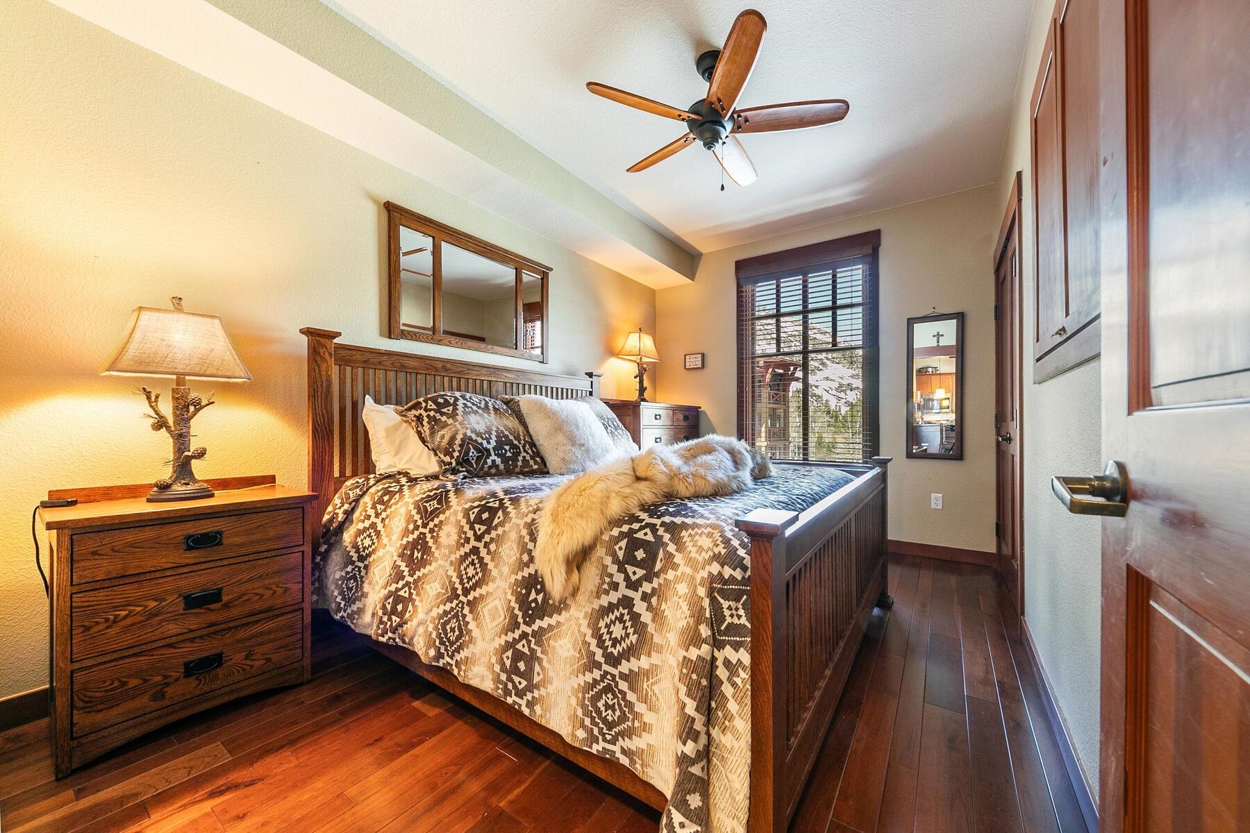1880 Village South Road, Unit 3334 Olympic Valley, CA 96146 - Photo 20 of 27 a bed room with a bed and a lamp on dresser
