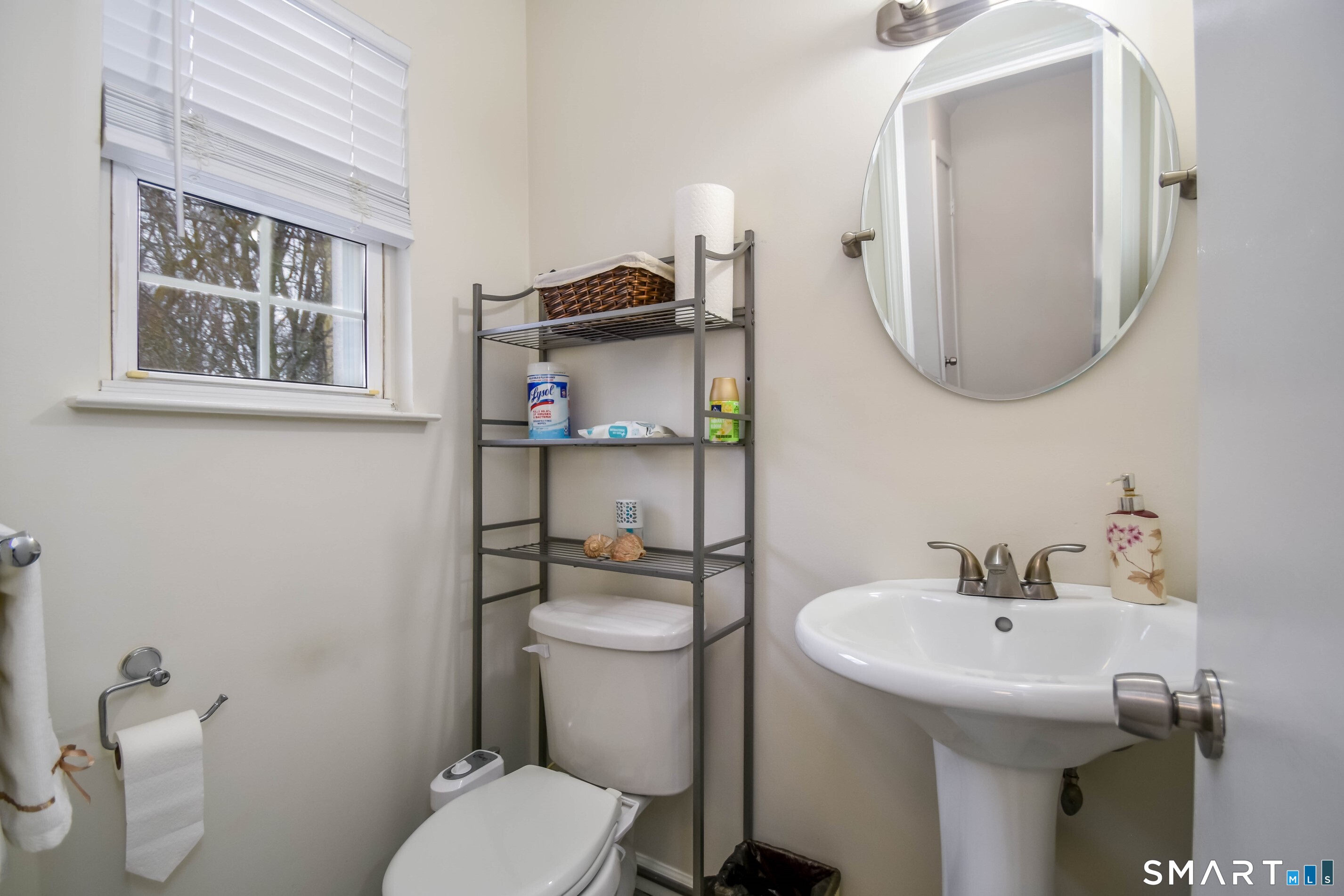 1403 Old Town Road, Unit 1403 Bridgeport, CT 06606 - Photo 13 of 25 a bathroom with a toilet sink and mirror