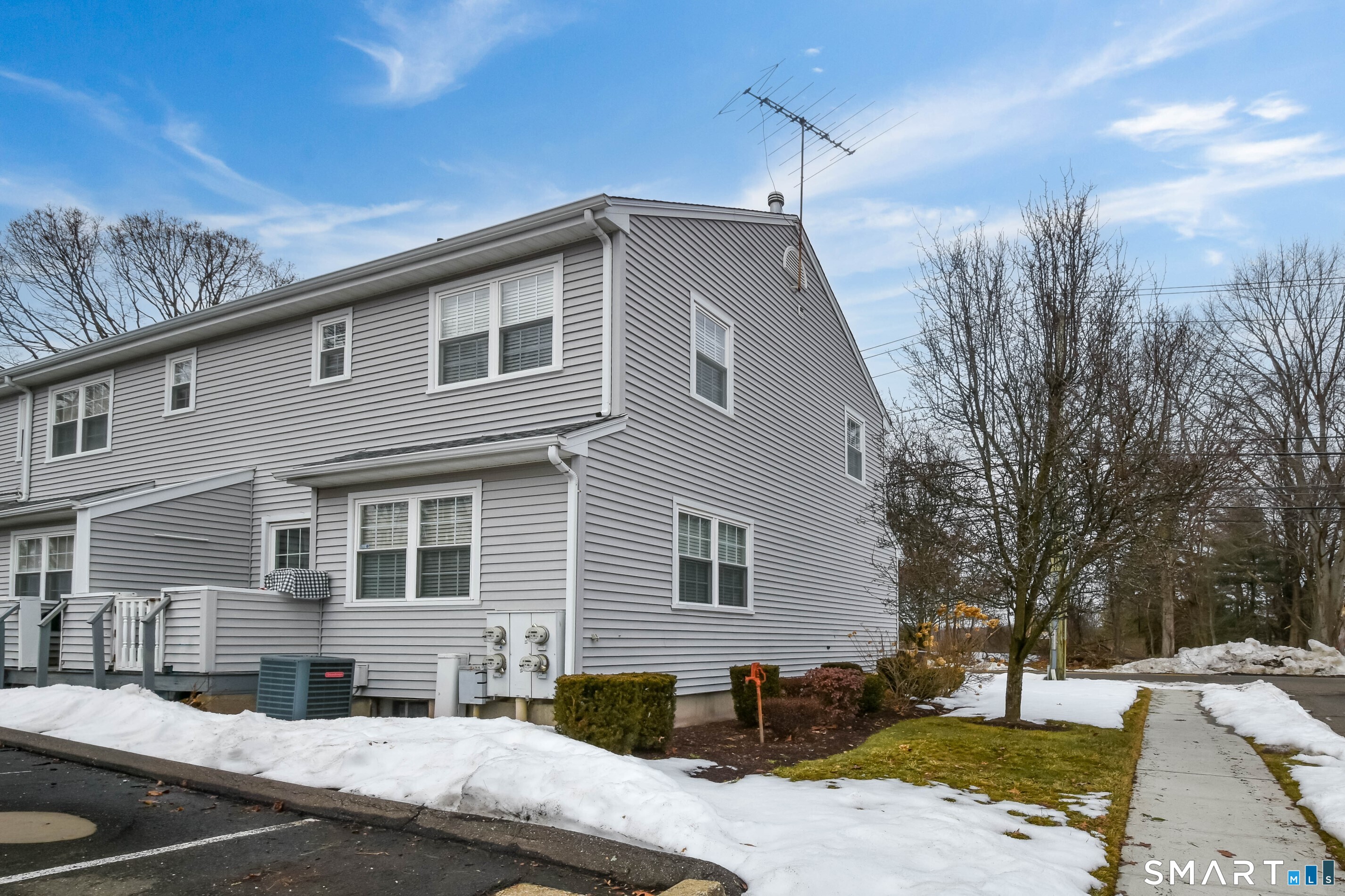 1403 Old Town Road, Unit 1403 Bridgeport, CT 06606 - Photo 16 of 25 a front view of a house with a yard