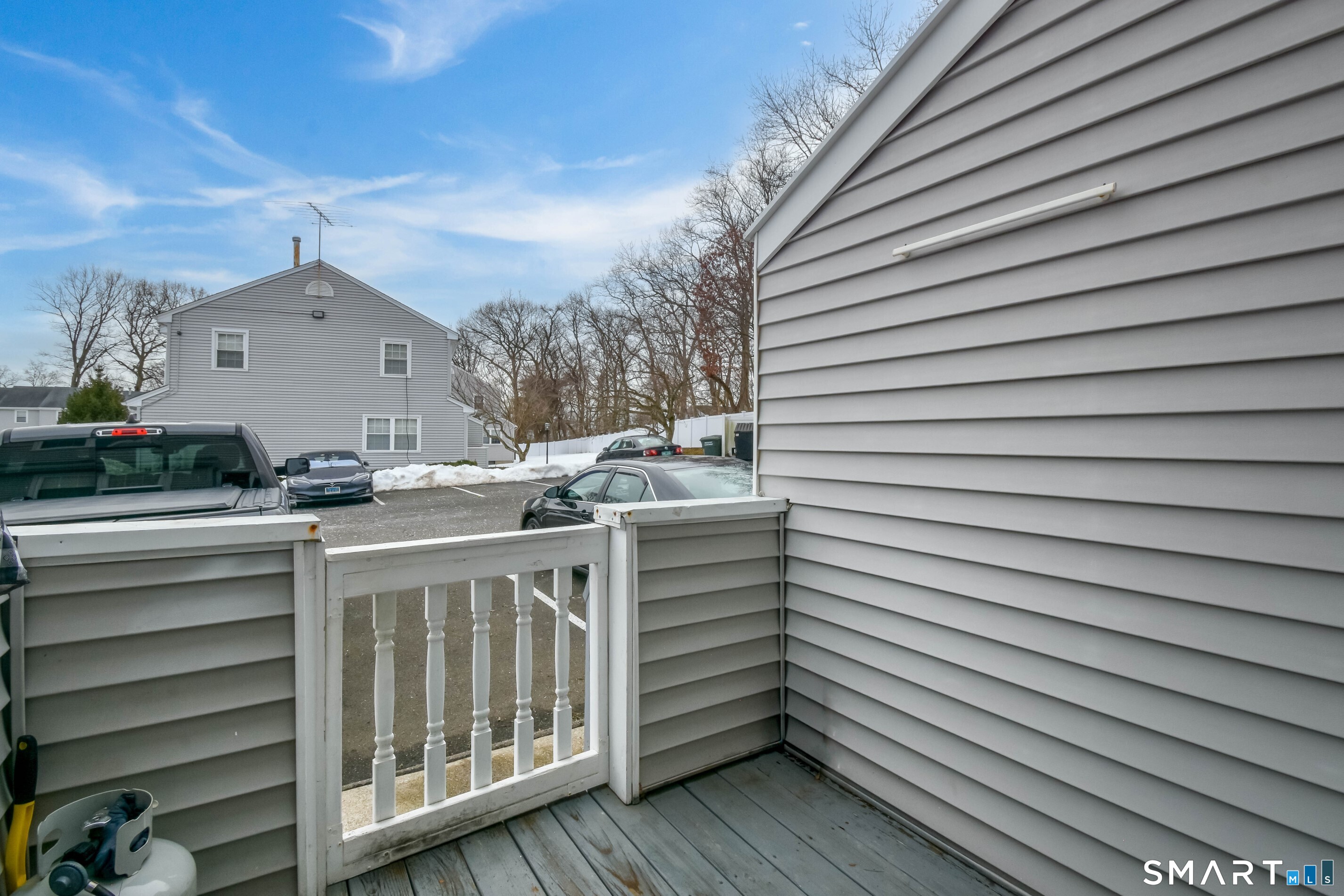 1403 Old Town Road, Unit 1403 Bridgeport, CT 06606 - Photo 2 of 25 a view of a white house with a sink and a wooden floor