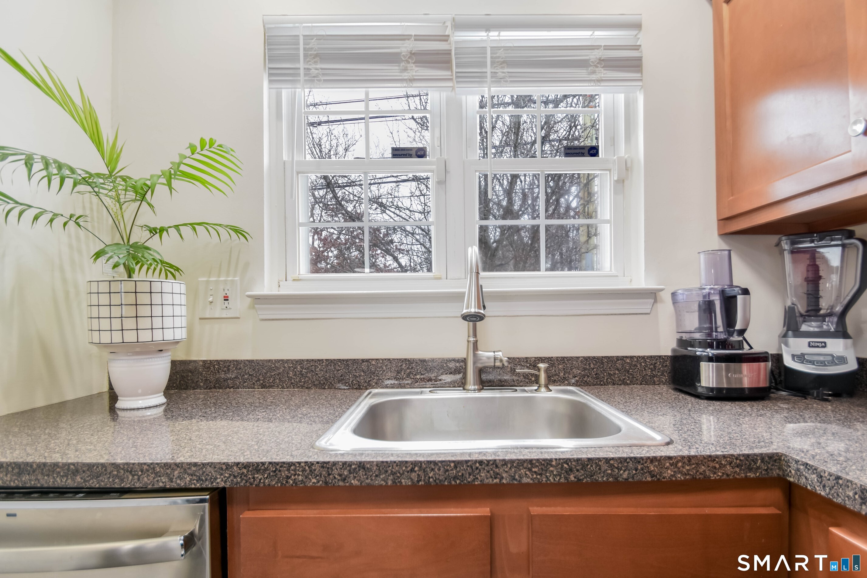 1403 Old Town Road, Unit 1403 Bridgeport, CT 06606 - Photo 22 of 25 a bathroom with a granite countertop sink and a window