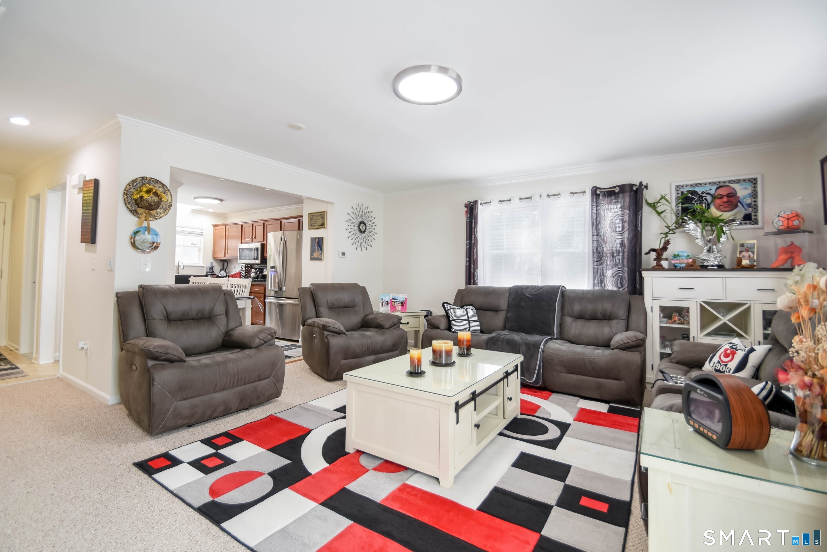 1403 Old Town Road, Unit 1403 Bridgeport, CT 06606 - Photo 4 of 25 a living room with furniture and a flat screen tv