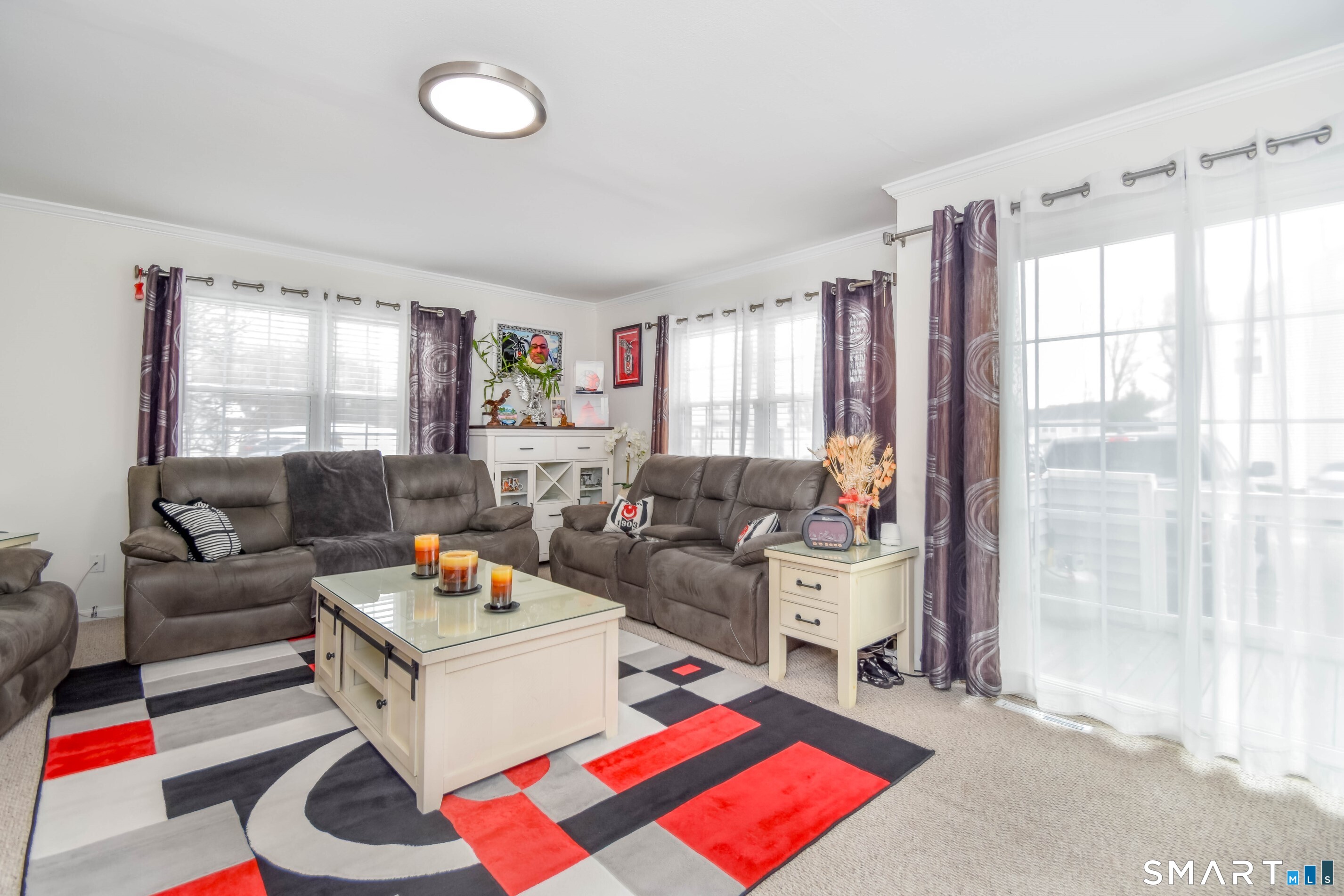 1403 Old Town Road, Unit 1403 Bridgeport, CT 06606 - Photo 5 of 25 a living room with furniture and a large window