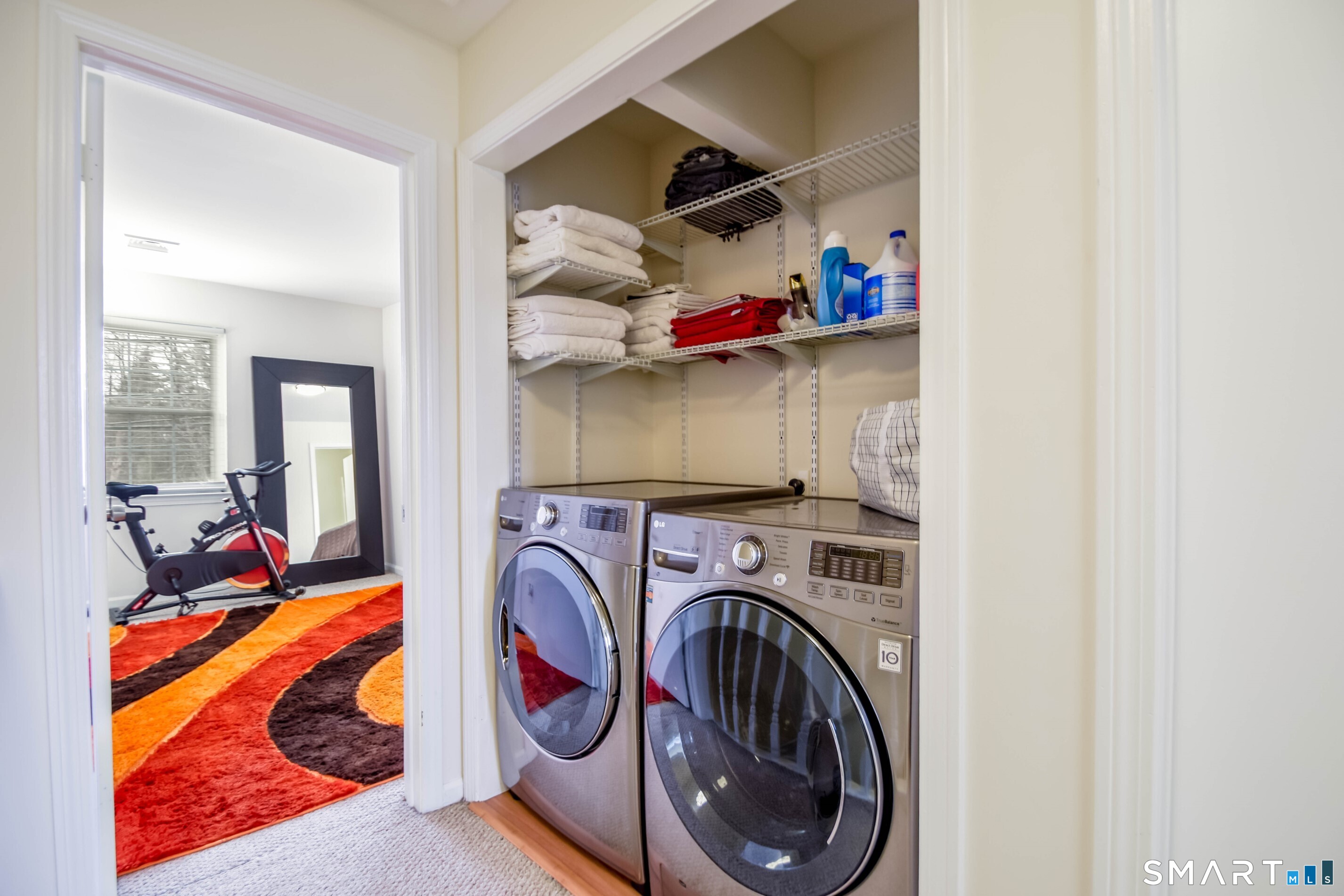 1403 Old Town Road, Unit 1403 Bridgeport, CT 06606 - Photo 9 of 25 a view of walk in closet with clothes and shoes