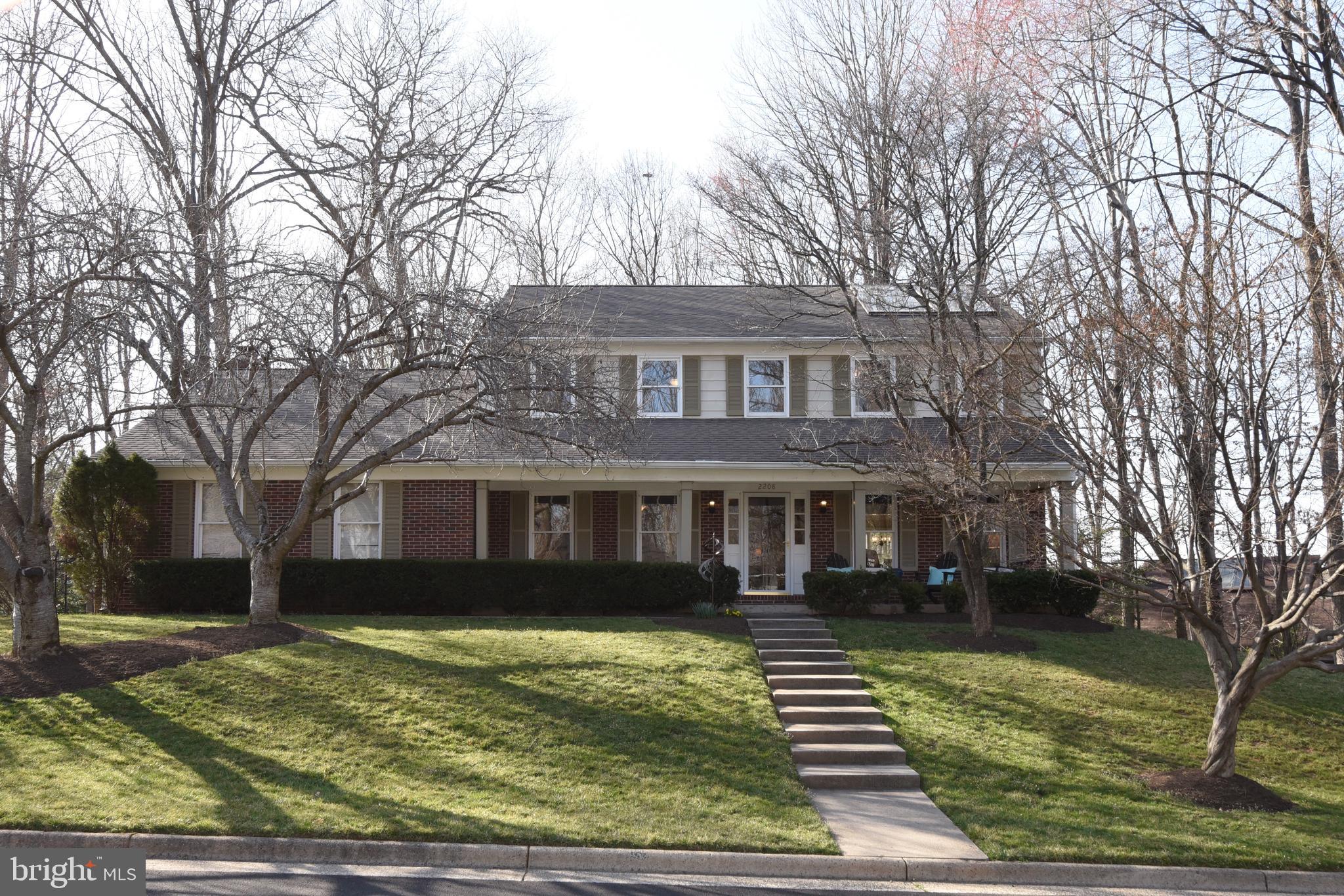 2208 Spinnaker Court Reston, VA 20191 - Photo 1 of 39 a front view of a house with a yard
