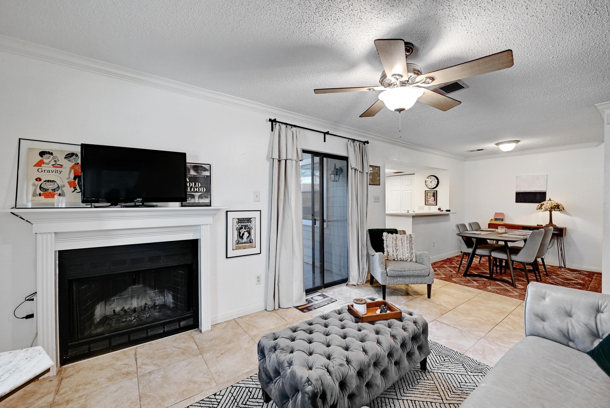 7635 Guadalupe Street, Unit 1002 Austin, TX 78752 - Photo 1 of 27 a bedroom with a bed and a fireplace